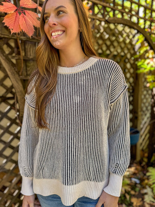 Black and cream two tone sweater worn with light jeans | V-Rae's Boutique
