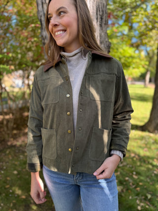 Woman in an olive corduroy barn jacket with brown collar | V-Rae's Boutique