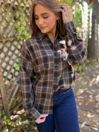 Close-up of a navy and gold plaid flannel button-up shirt | V-Rae's Boutique