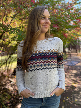 Woman in an oatmeal fair isle chevron knit sweater with jeans | V-Rae's Boutique
