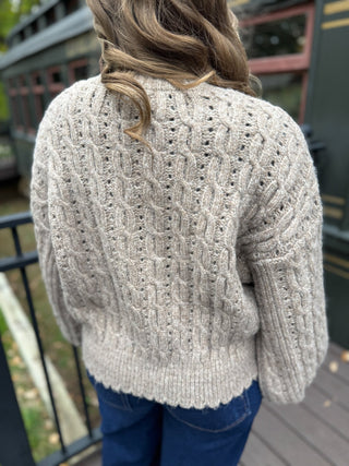 Back view of a taupe cable knit cardigan | V-Rae's Boutique