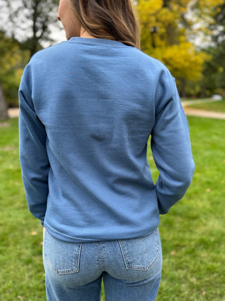 Back view of a blue crewneck sweatshirt | V-Rae's Boutique