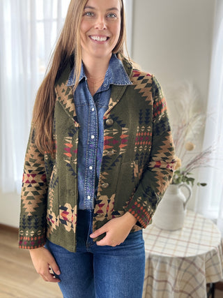 Woman wearing a patterned jacket indoors