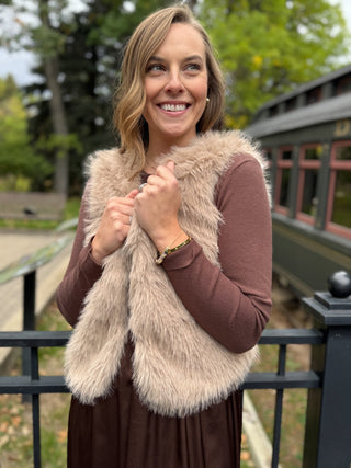 Taupe faux fur vest over a brown dress | V-Rae's Boutique