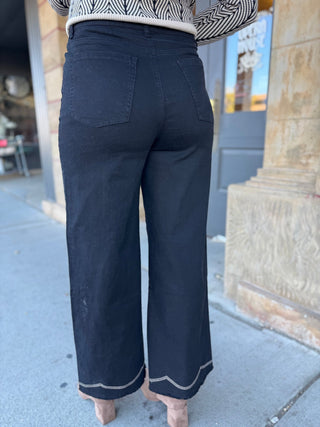 Back view of black embroidered wide leg jeans | V-Rae's Boutique