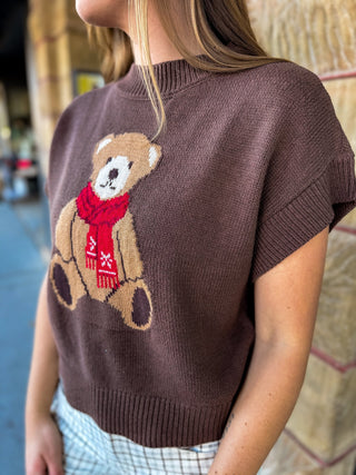 Close-up of the teddy bear graphic on a brown sweater | V-Rae's Boutique