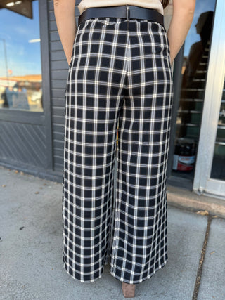 Back view of black and white plaid wide-leg pants | V-Rae's Boutique