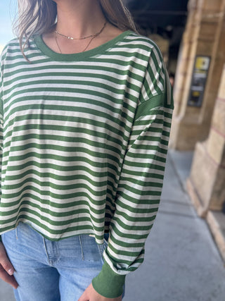 Close-up of a green and white striped open back top | V-Rae's Boutique