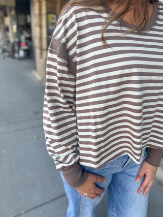Close-up of a taupe and cream striped open back top | V-Rae's Boutique