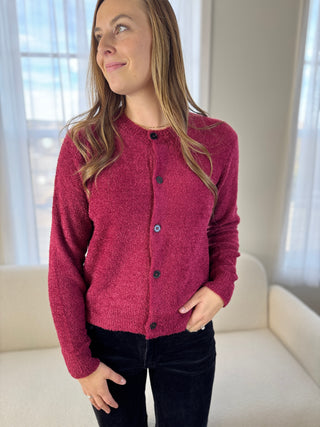 Photo of a woman in a fuzzy cardigan.