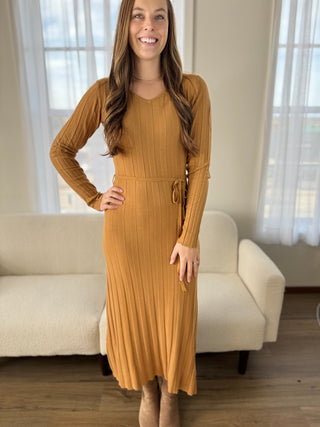 Photo of a woman in a fitted bodycon dress.