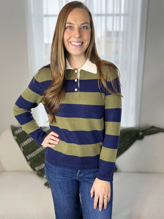 Photo of a woman in a striped sweater.