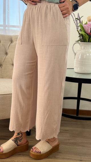 Person wearing beige pants in a living room setting