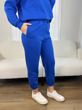 Woman in blue joggers.