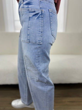 Light blue jeans worn by a person with a blurred background