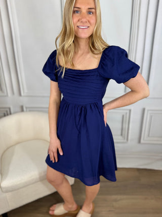 Amelia Smocked Mini Dress - V - Rae’s Boutique