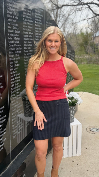 Woman is wearing a red tank for Memorial Day.