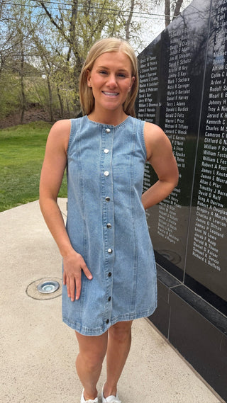 Woman is wearing a denim dress for Memorial Day.