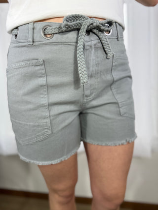 Light gray denim shorts with braided drawstring on a plain background