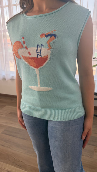 Photo of a woman wearing a graphic sweater.