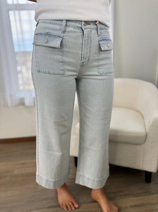 Woman wearing pinstripe pants.
