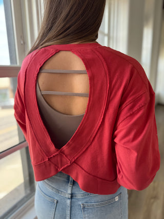 Woman wearing an open back top.