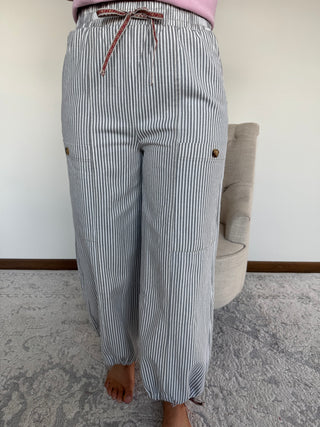Woman wearing striped pants.