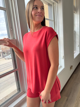 Model is wearing a bright lounge set.