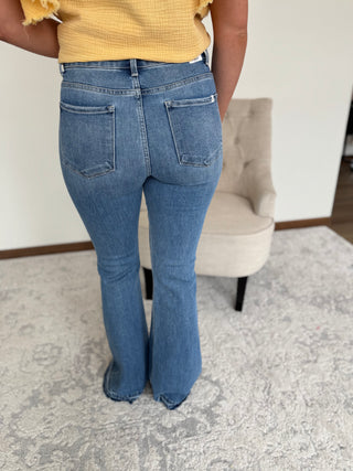 Woman wearing flare jeans.