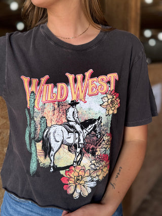 Person wearing a black t-shirt with 'Wild West' graphic design featuring a cowboy on a horse.