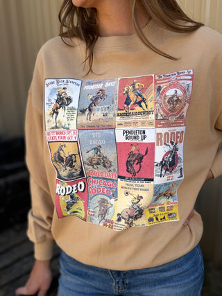 Person wearing a beige sweatshirt with vintage rodeo poster designs on the chest.