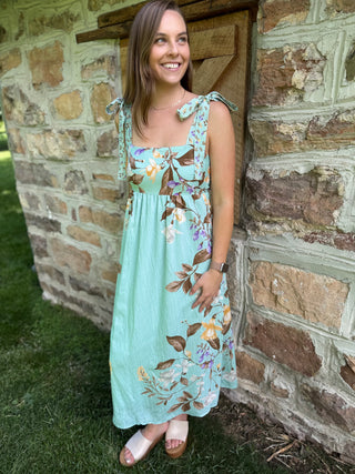 Model wearing floral tank dress.