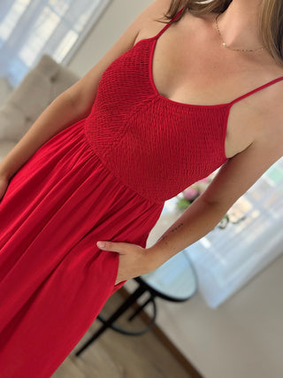 Photo of a woman wearing a red dress.