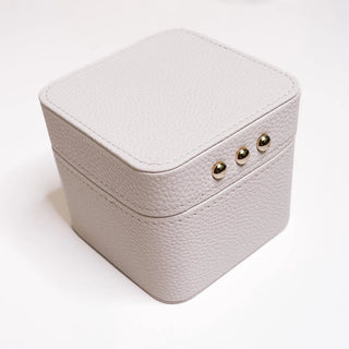 White jewelry box with gold accents on a white background